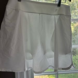 Puma golf/tennis skort. Tags removed but never worn. Size M.